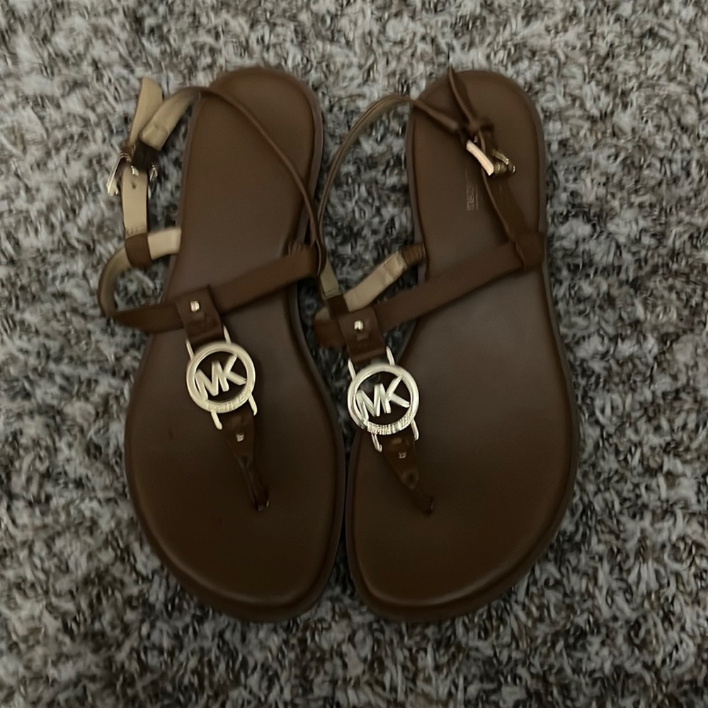 Tan Michael Kors sandals.